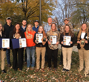 Photo of Michelle Johnson, Madison Folk, Shelby Judd, Kaiti Collins, Shelby Fryar, Kristy Kruger, Katie Hoffman, Matt Holste, Aaron Ackerman, Justin Kalina, Leland Houzenga, Andrew Gustafson