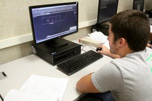 Male student using CAD
