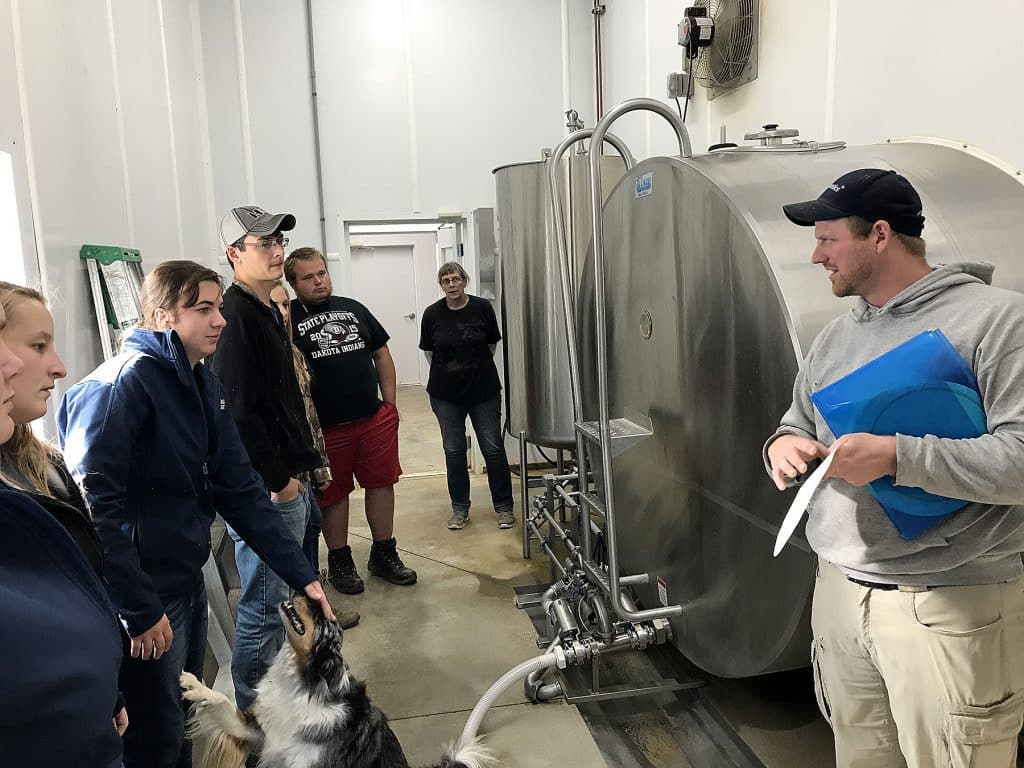 Highland students observing a milk tank