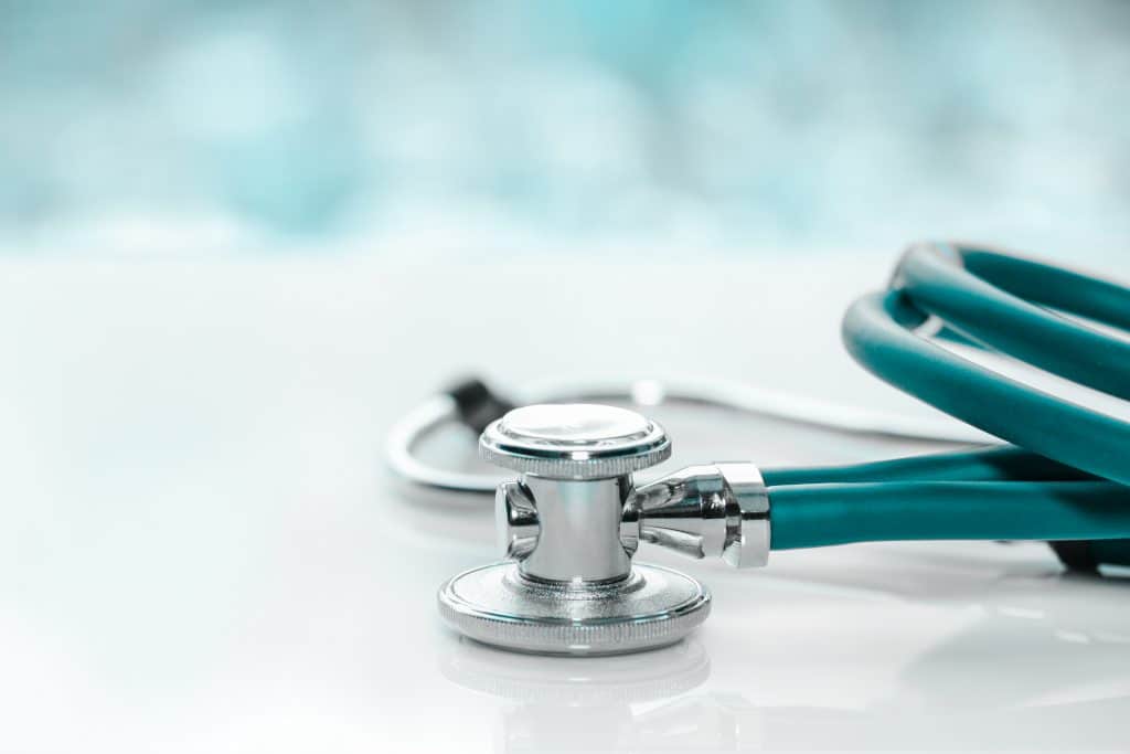 blue stethoscope on blurred background