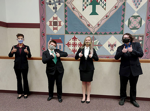 Forensics team members give a thumbs up