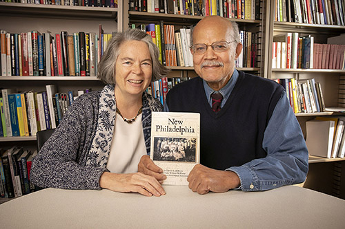 Kate Williams and Gerald McWorter with their book New Philadelphia