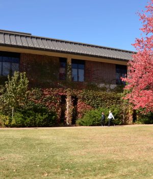 Picture of Building H with students walking by.