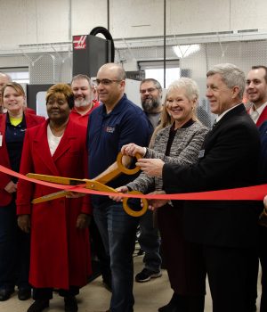 Representatives from Highland Community College and the Greater Freeport Partnership cut the ribbon on a new CNC lab.