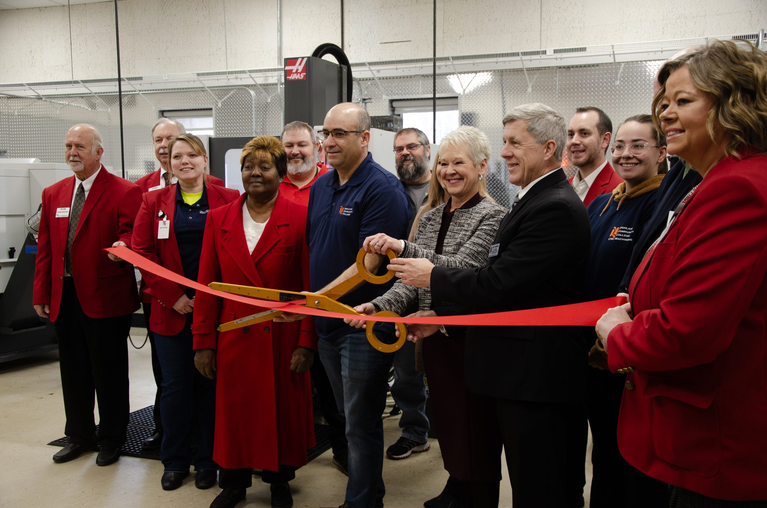 Representatives from Highland Community College and the Greater Freeport Partnership cut the ribbon on a new CNC lab.