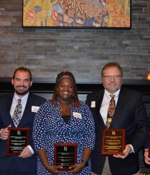 Highland's five distinguished alumni for 2024 are pictured with their plaques.