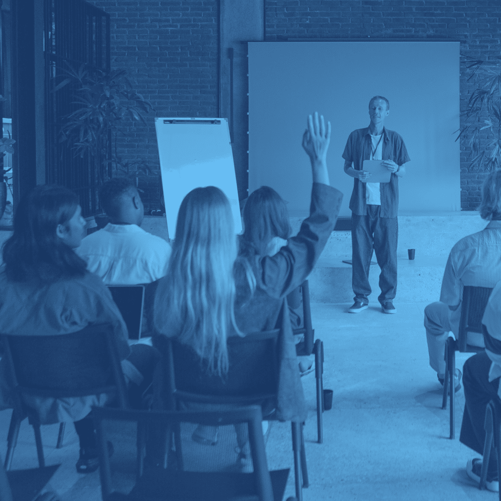 duotoned photo of instructor training students