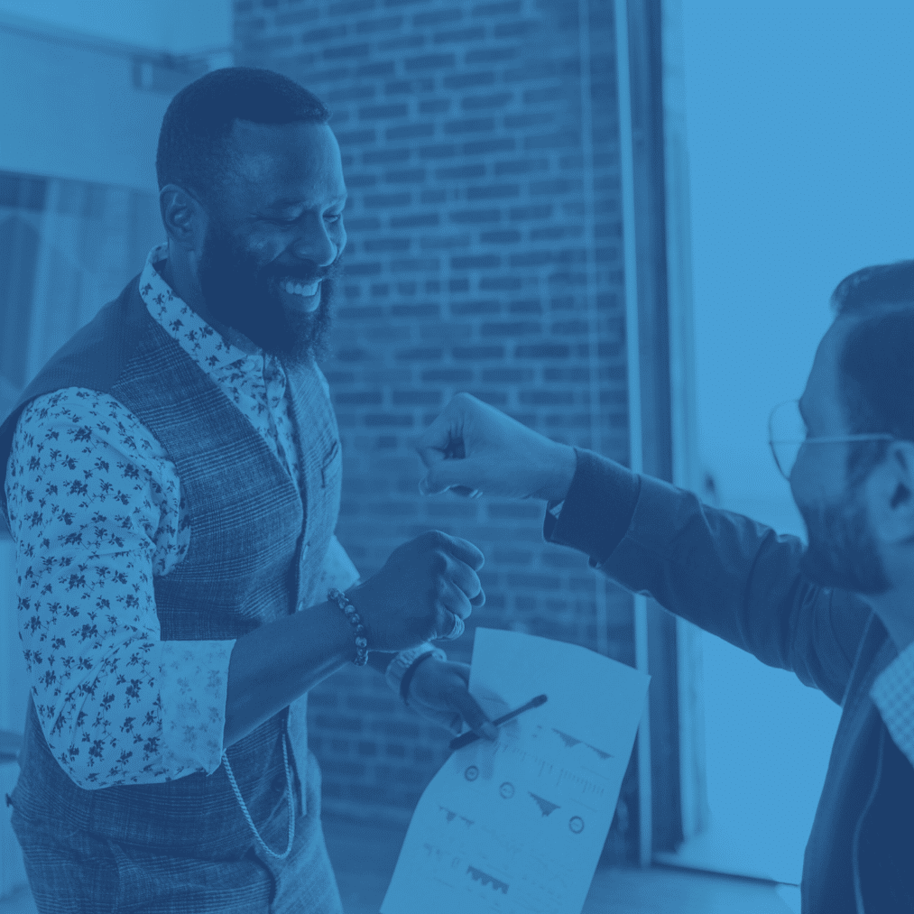 two men fist pumping